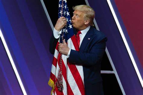 President Trump kissing the Flag