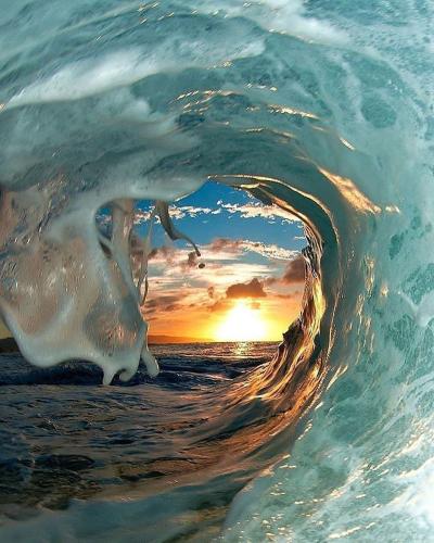 Sunset - Through crest of wave in Hawaii