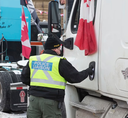 Police go Truck to Truck  handing out Notices