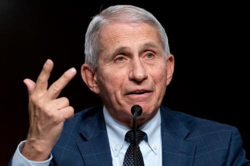 Fauci Flashing the Triple Booster Gang Sign