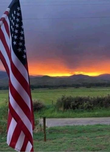 Flag - With sunset over the mountains