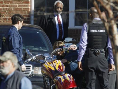 IRS-agent-seizes-a-motorcycle.-640x480