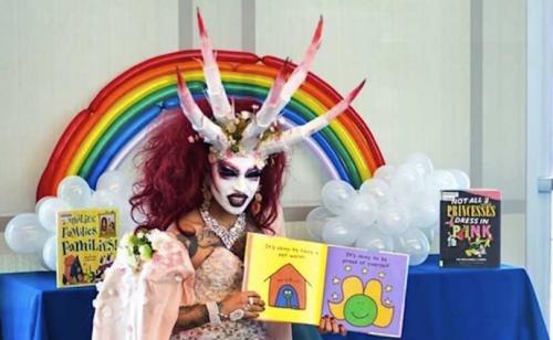demon-transgender-reading-books-children