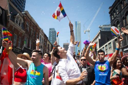 Justin Trudeau -  waving a flag of his country that's been desecrated.