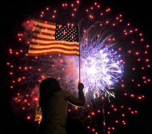 Flag - Little girl with flag at fireworks