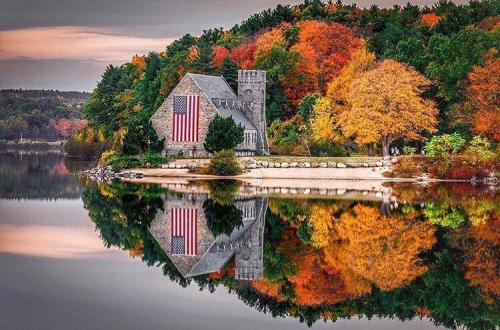 Flag - In autumn on building at lake