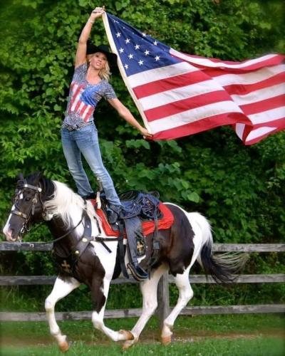 Flag - Girl standing while riding horse