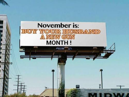 Sign - Buy your husband a new gun month