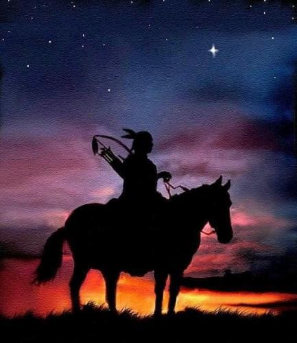 Indian - On horse as sun goes down
