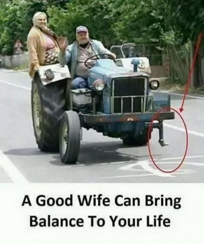 Husband, Wife -- Wife balances Tractor and Life