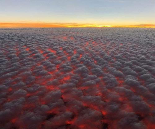Sunset over Clouds -- Looks like lava melting in the Sky
