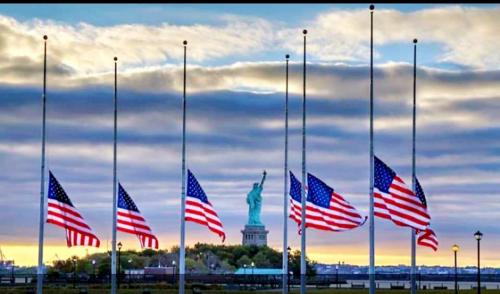 Flag - Seven flags at half mast with Statue of Liberty