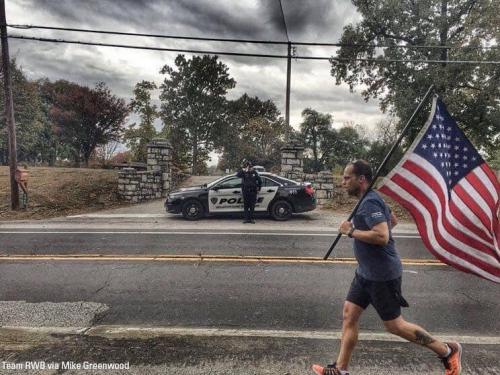 Flag - Man running past cemetery