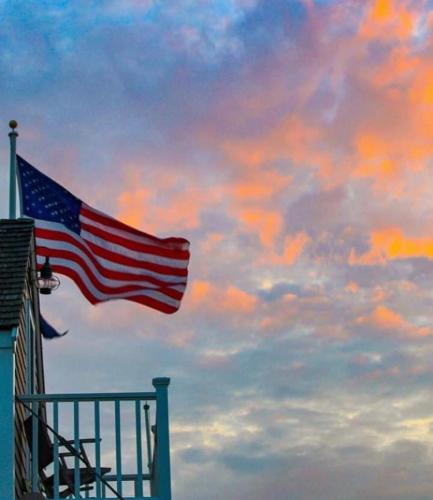 Flag - Above balcony at sunset