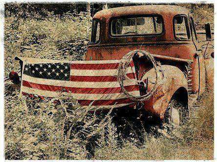 Flag - On old pick-up in field