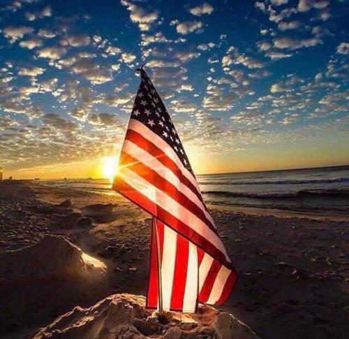 Flag - On beach with setting sun